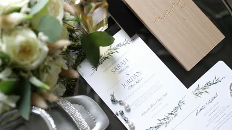 close up of wedding bouquet and invitation