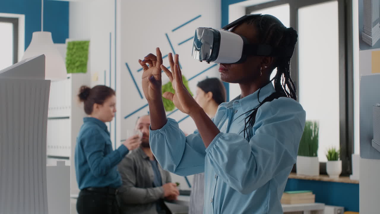 African American woman using VR in a modern office