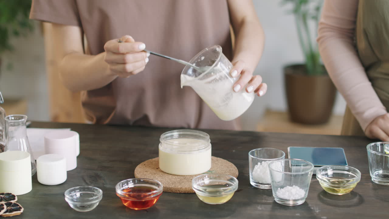 Pouring Handmade Cream Into Container