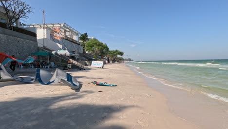 setting up kite surfing gear by the seaside.