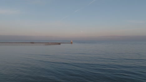 experience the transition from vibrant sunset to moonlit calm over blyth harbour in stunning aerial detail.