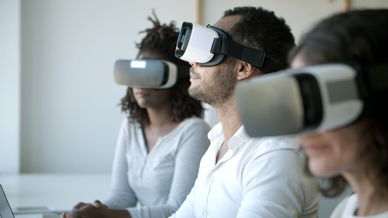 Focused people with VR headsets sitting at office