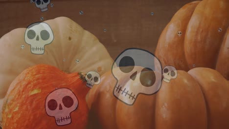 Animation-of-happy-halloween-text-over-skulls-and-pumpkins