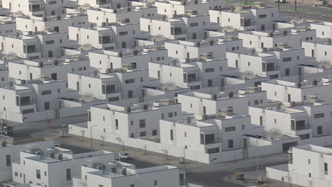 similar-white-houses-constructed-near-the-sea-medium-shot