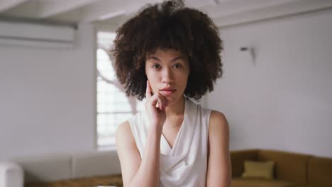 Front-view-of-mixed-race-woman-in-creative-office