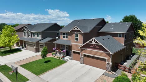 upscale, modern home in usa with beautiful landscaping and hanging planter flowers