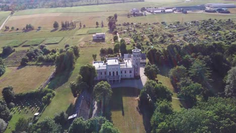 Vecauce-Manor-in-Latvia-Aerial-View-of-the-Pink-Castle-Through-the-Park