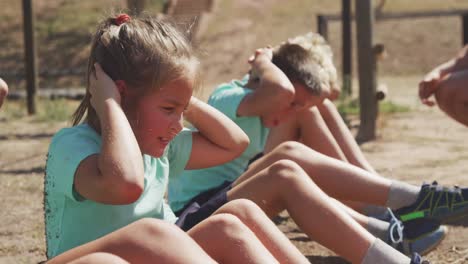 group of caucasian children training at boot camp