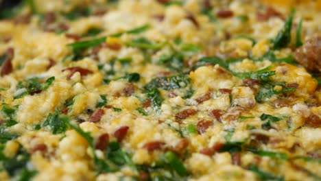 close-up of scrambled eggs with herbs