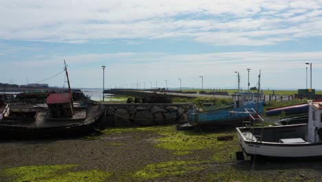 Beached-and-decrepit-boats-near-Nimmo's-pier,-Claddagh-docks-Galway-Ireland