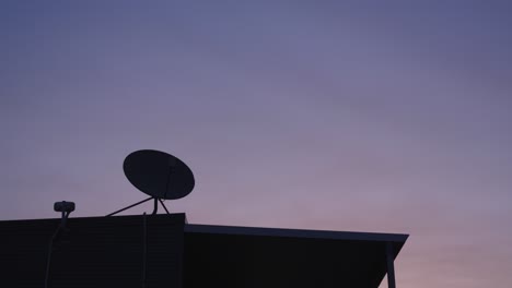 aerial tv radio antenna highlight, clear sky twilight at night, still video