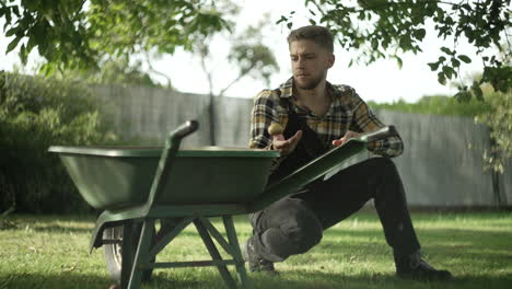 Man-colleting-Rotten-apples-from-the-garden