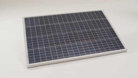 Video-of-close-up-of-solar-panel-on-white-background