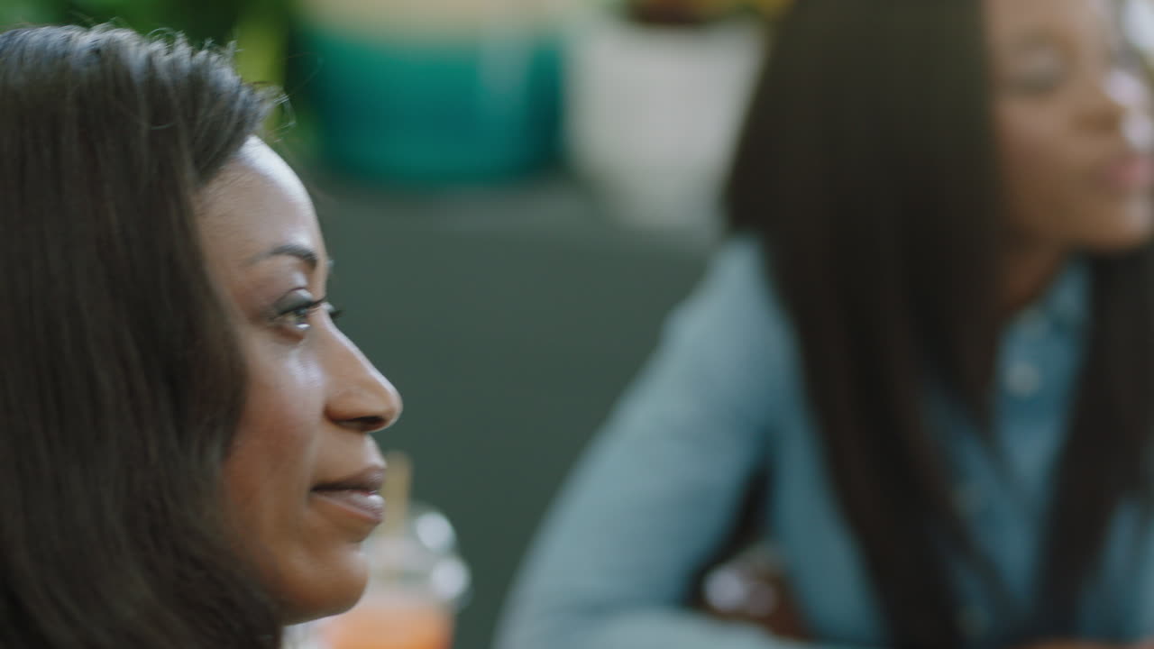 close up african american business woman using smartphone filming office presentation enjoying mobile phone camera technology sharing meeting on social media recording video