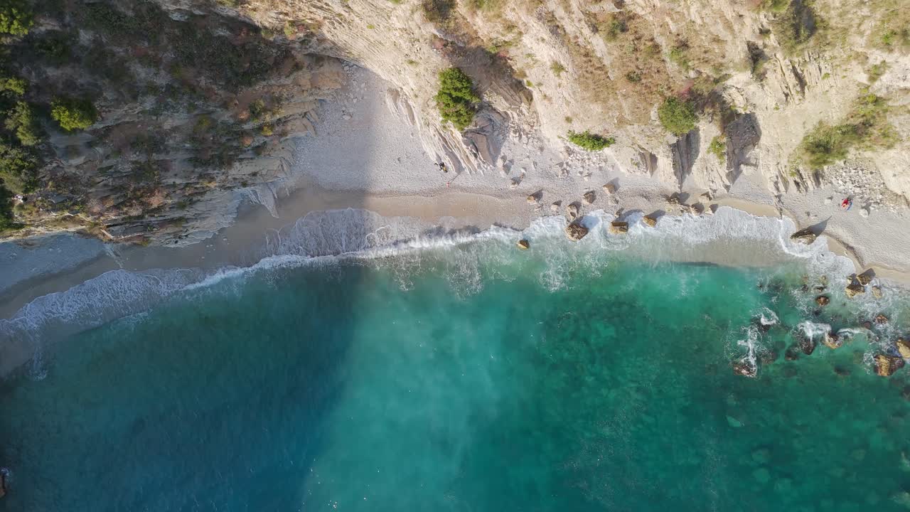 Top down aerial view of Albanian Riviera secluded Filikuri Beach turquoise sea water