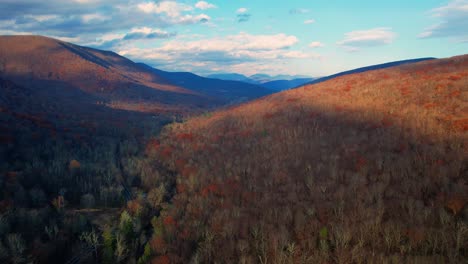 aerial drone video footage of the magical, beautiful appalachian mountains during fall autumn with beautiful golden light and skies