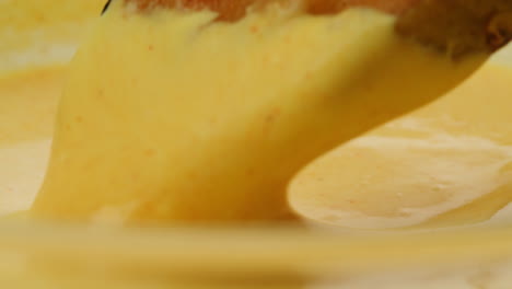 crispy fried potatoes in a yellow dip