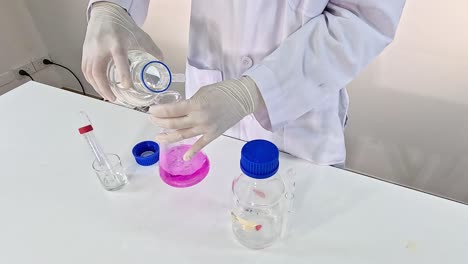 scientist conducts chemical reaction with potassium permanganate