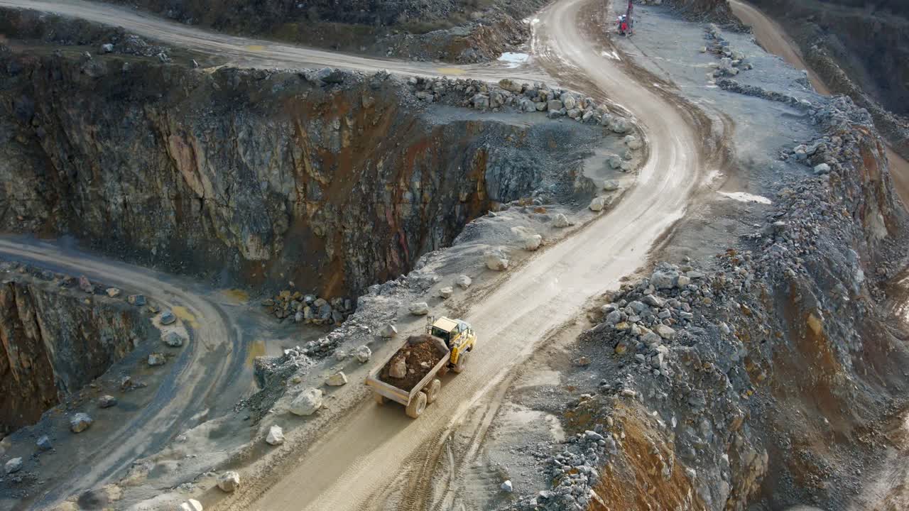 Mining on a Grand Scale: An Aerial View of a Haul Truck Navigating the Roads of a Limestone Quarry in Germany