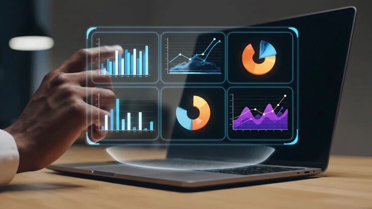 Person analyzing business intelligence data on a futuristic holographic dashboard from a laptop