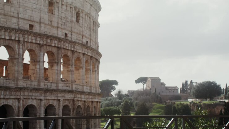 A woman comes to the observation deck of the Colosseum and takes a photo