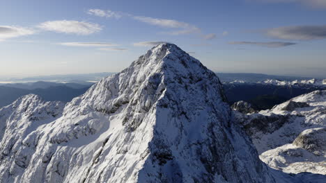 snowy mountain peak at sunrise