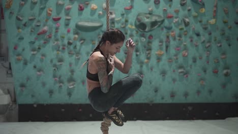 woman rope climbing
