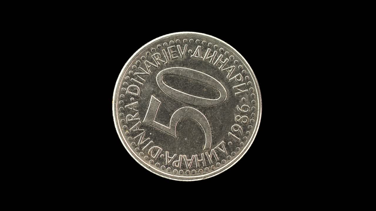 Yugoslavia 1986 50 dinara coin reverse with large denomination and multilingual currency text rotating on black background