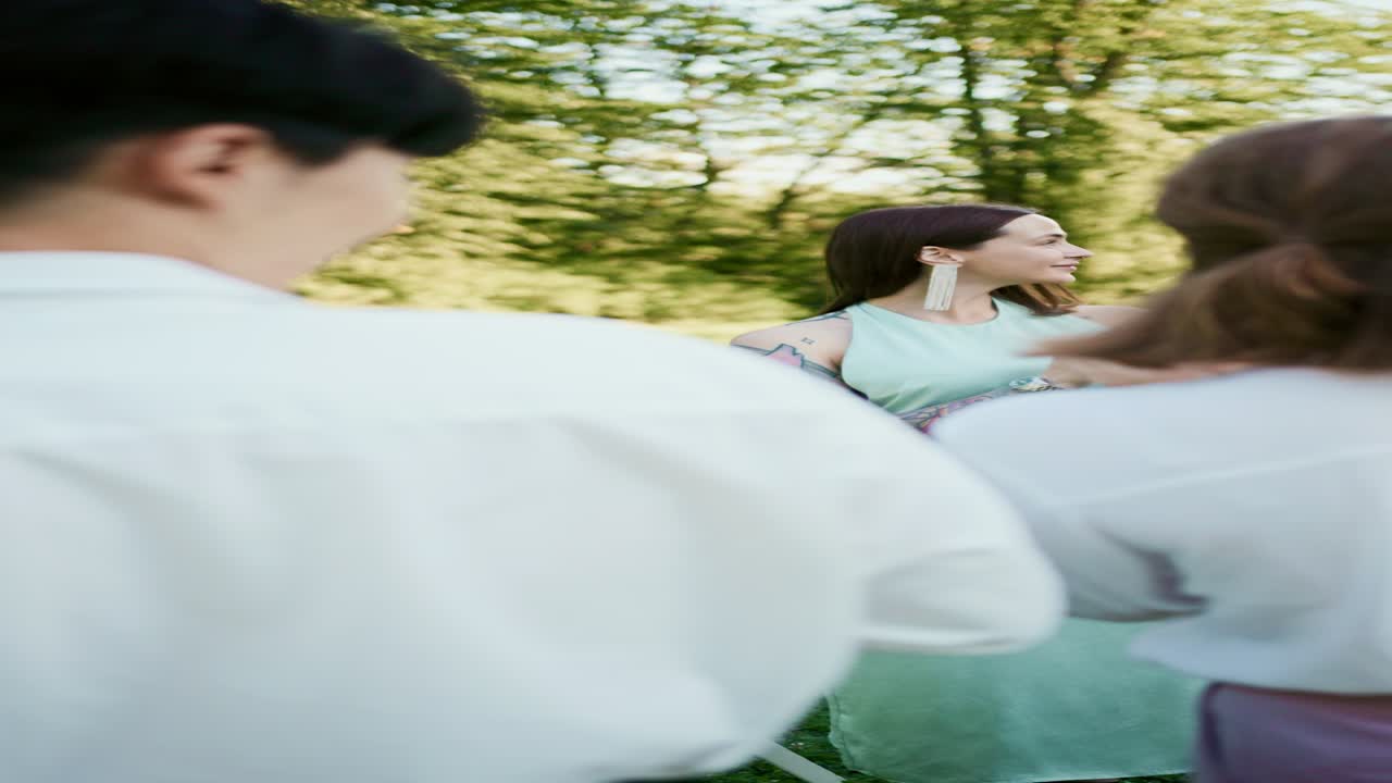People applauding in an outdoor setting