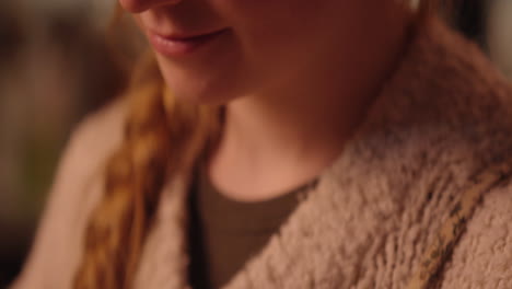 close up of a woman with a sweater