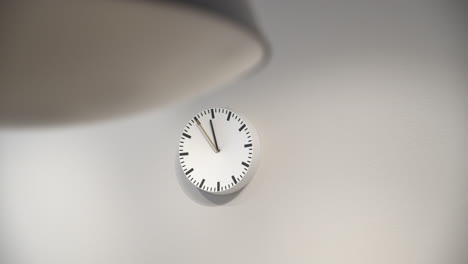 white mechanical wall clock on white background