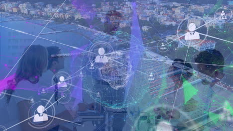 animation of connected icons, globe, aerial view of city, diverse colleagues discussing in meeting