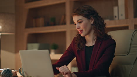satisfied employee finish work in dark agency office closeup. smiling woman