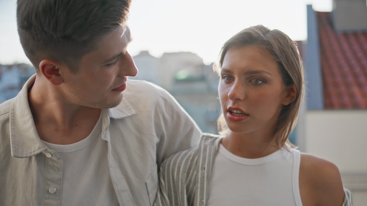 Man woman communicating balcony on evening date. Closeup happy boyfriend kissing