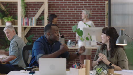 african american businessman cheering excited celebrating success happy business team enjoying congratulating colleague in diverse office workspace