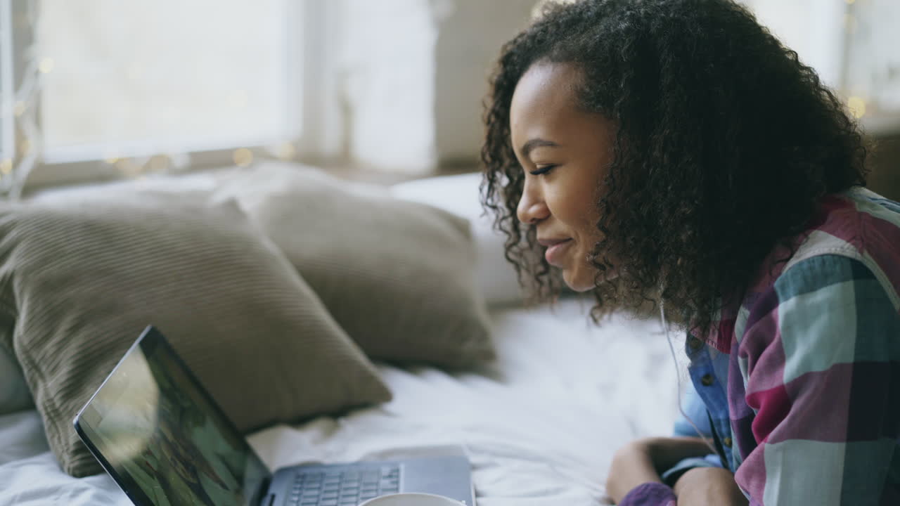Teenage Girl Video Chatting on Laptop