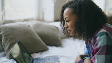 teenage girl video chatting on laptop
