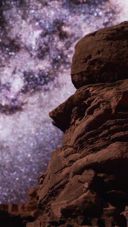 red rock formations under a starry night sky