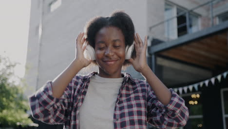 woman enjoying music outdoors