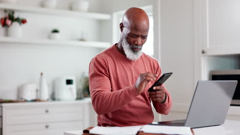 Phone,-laptop-and-budget-with-a-senior-black-man