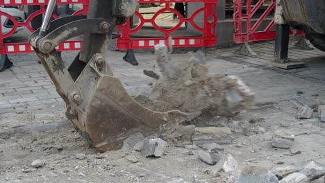 excavation site with broken paving stones