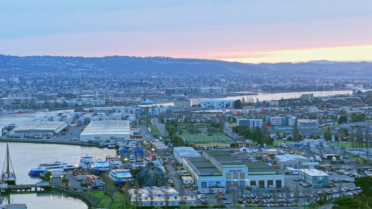 A slow aerial panning shot of the western part of Alameda California. Footage shot in 4K on a DJI Air 3S drone.