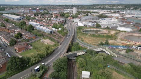Cars And Bus Driving Along The Northam Traincare Facility Near St Mary's Stadium In Southampton, England, UK. - aerial shot