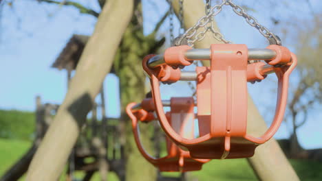 Empty-playground-swings-on-a-sunny-autumn-afternoon