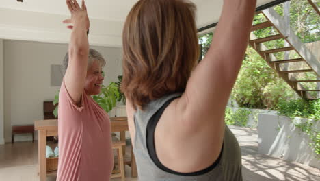 senior women practicing yoga together at home, enjoying peaceful exercise session