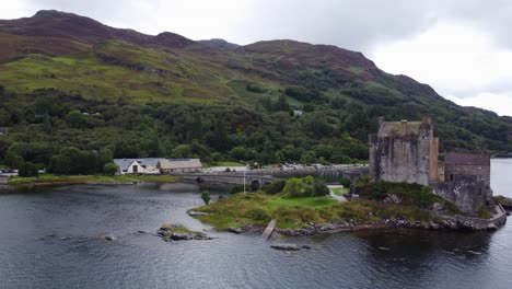 eilean donan castle on loch long near dornie, west coast of scotland, scottish highlands - aerial drone 4k hd footage circle right