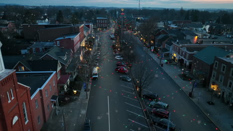 Aerial-truck-shot-of-town-square-at-night