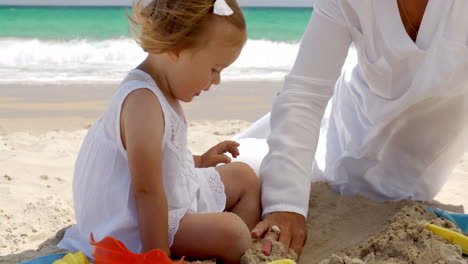 Little-girl-playing-on-a-tropical-beach