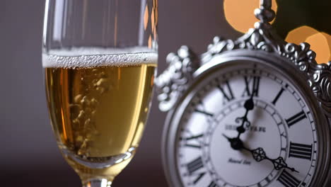 champagne and clock - new year's eve celebration