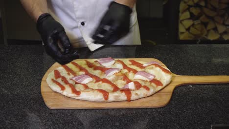 chef preparing a pizza